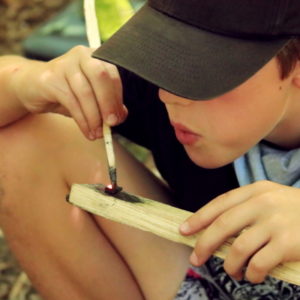 boy using a firestarter kit