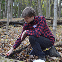 Suny ESF student working on land stewardship tasks at Baltimore Woods.