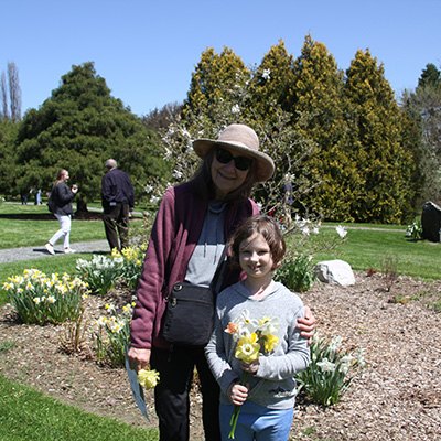Family members with daffodil at Sycamore Hill Gardens.