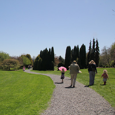 Family walking together at Sycamore Hill Gardens in spring