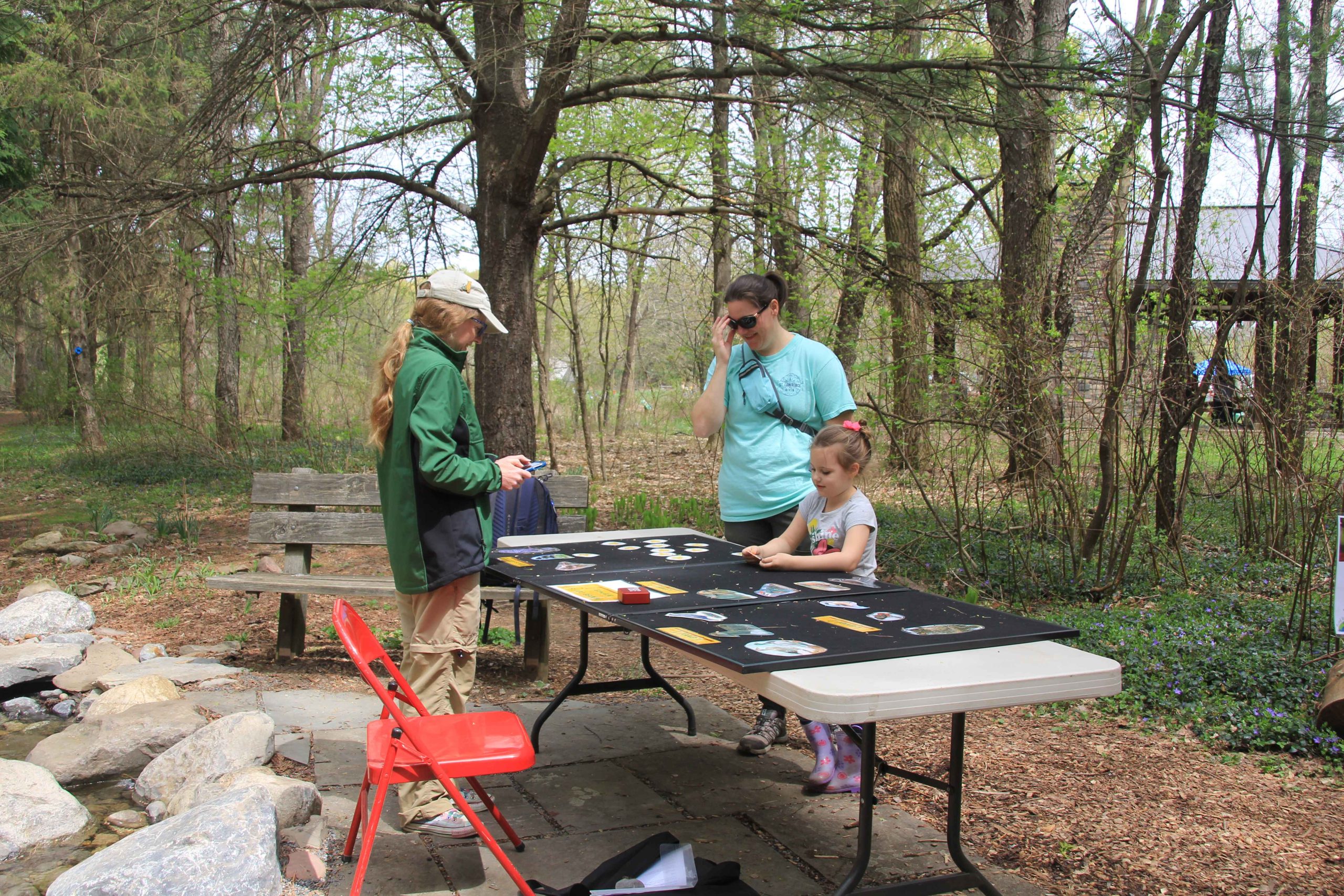 Guests playing a bird call guessing game at the 2023 Earth Day Celebration at Baltimore Woods.