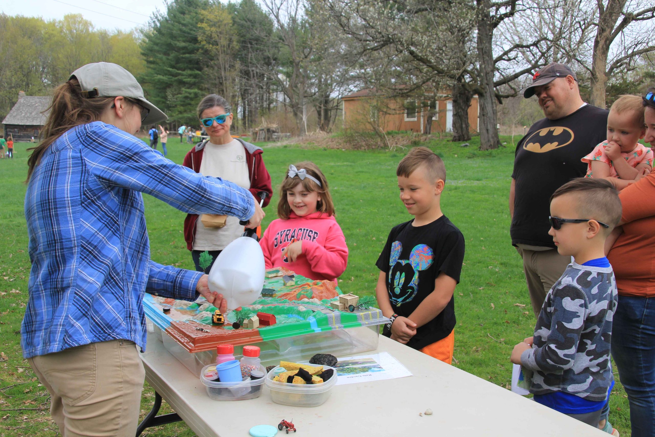 Watershed model demonstration by an environmental educator Parking crew at the 2023 Earth Day Celebration at Baltimore Woods.