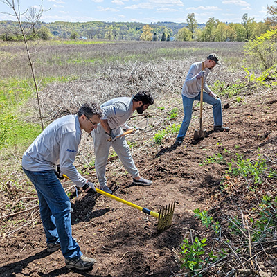 Group working outdoors on a stewardship project at Baltimore Woods.