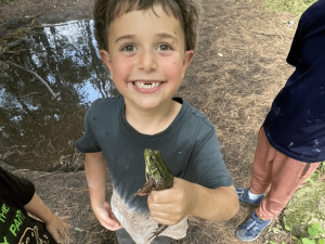 Baltimore Woods camper holding a frog.