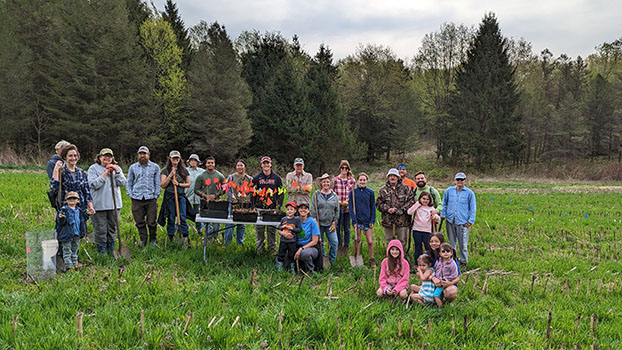stewardship project on earth day at baltimore woods - group of people in the field