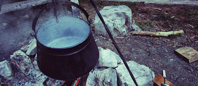 Cooking pot over outdoor fire