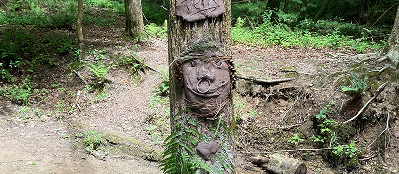 Clay face on a tree
