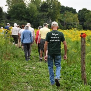 Volunteers and donors walking the new trails at Baltimore Woods.