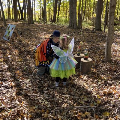 Volunteer and child at the Fairy Festival at Baltimore Woods Nature Center.
