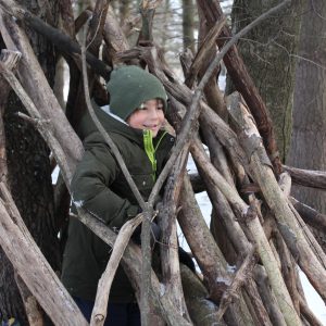 October- Nature’s Builders NLE participant in a tree fort at Baltimore Woods.