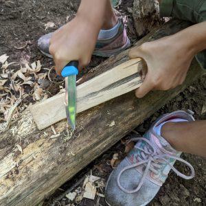 Camper using wilderness skills at Baltimore Woods