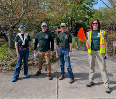 volunteers standing outside looking to help people